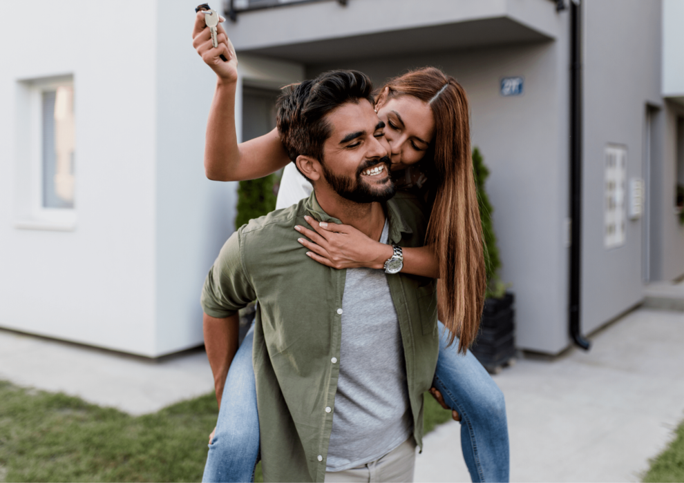 Couple out the front of their home